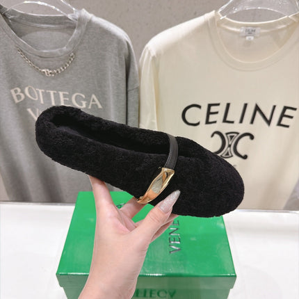 BOTTEGA VENETA 26S MULES IN BLACK SHEARLING WITH LEATHER STRAP