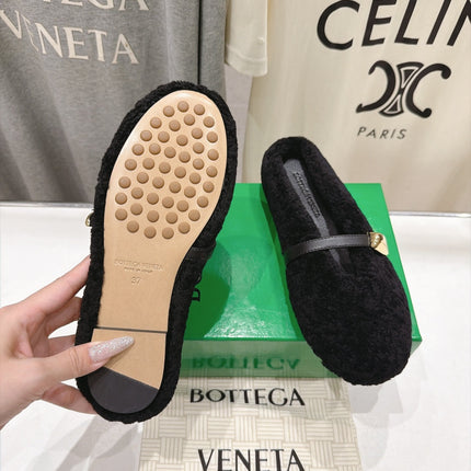 BOTTEGA VENETA 26S MULES IN BLACK SHEARLING WITH LEATHER STRAP