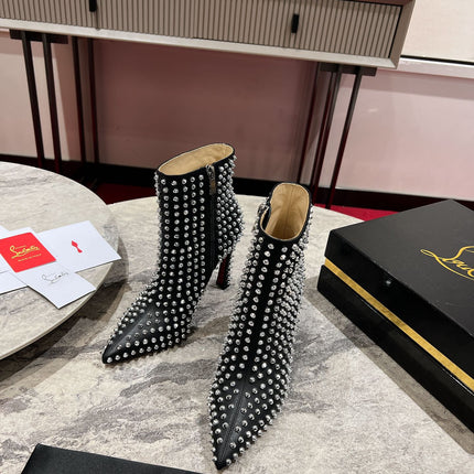 CHRISTIAN LOUBOUTIN 26S STUDDED ANKLE BOOTS 100 MM IN BLACK CALFSKIN