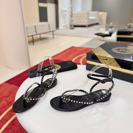 CHRISTIAN LOUBOUTIN 26S STUDDED THONG SANDALS IN BLACK CALFSKIN