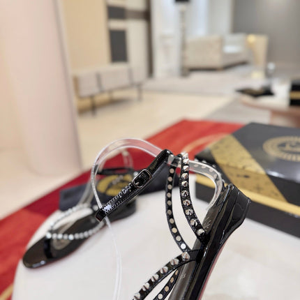 CHRISTIAN LOUBOUTIN 26S STUDDED THONG SANDALS IN BLACK PATENT CALFSKIN