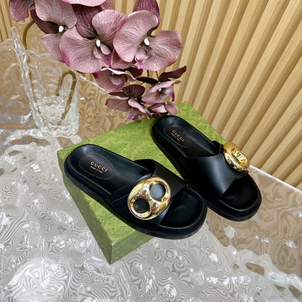 WOMEN'S SLIPPER IN BLACK CALFSKIN WITH GOLD HARDWARE