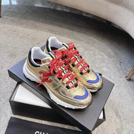 CHANEL 26S COLORBLOCK LOW TOP SNEAKERS IN GOLD CALFSKIN AND RED