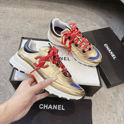 CHANEL 26S COLORBLOCK LOW TOP SNEAKERS IN GOLD CALFSKIN AND RED