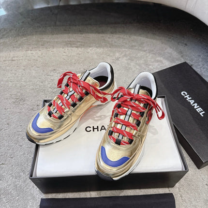 CHANEL 26S COLORBLOCK LOW TOP SNEAKERS IN GOLD CALFSKIN AND RED