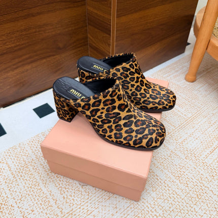 MIUMIU 26S BLOCK HEEL MULES IN LEOPARD PRINT PONY HAIR