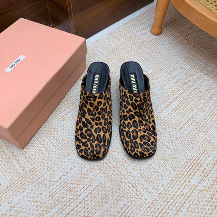 MIUMIU 26S BLOCK HEEL MULES IN LEOPARD PRINT PONY HAIR