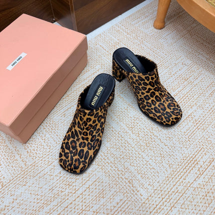 MIUMIU 26S BLOCK HEEL MULES IN LEOPARD PRINT PONY HAIR
