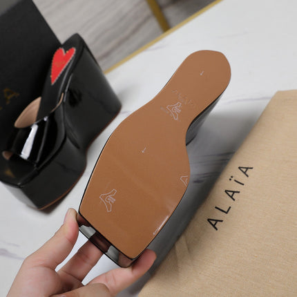 ALAIA PLATFORM WEDGE IN BLACK LAMBSKIN WITH RED HEART