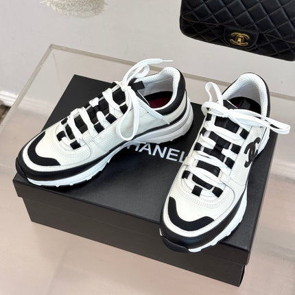 CHANEL 26S COLORBLOCK LOW TOP SNEAKERS IN WHITE CALFSKIN AND BLACK SUEDE