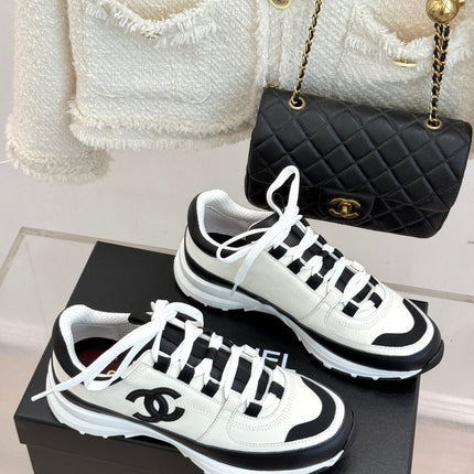 CHANEL 26S COLORBLOCK LOW TOP SNEAKERS IN WHITE CALFSKIN AND BLACK SUEDE