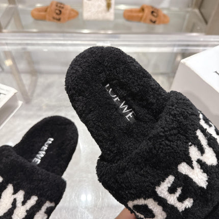 LOEWE 26S FLUFFY SLIDE SANDALS IN BLACK SHEARLING WITH WHITE LOGO
